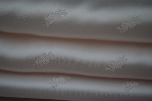 Tissu jacquard - motif lion - rose