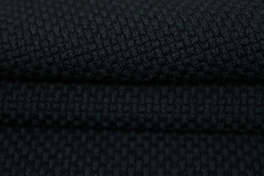 Tissu piqué de laine stretch - noir - photo 2/3 | So Tissus