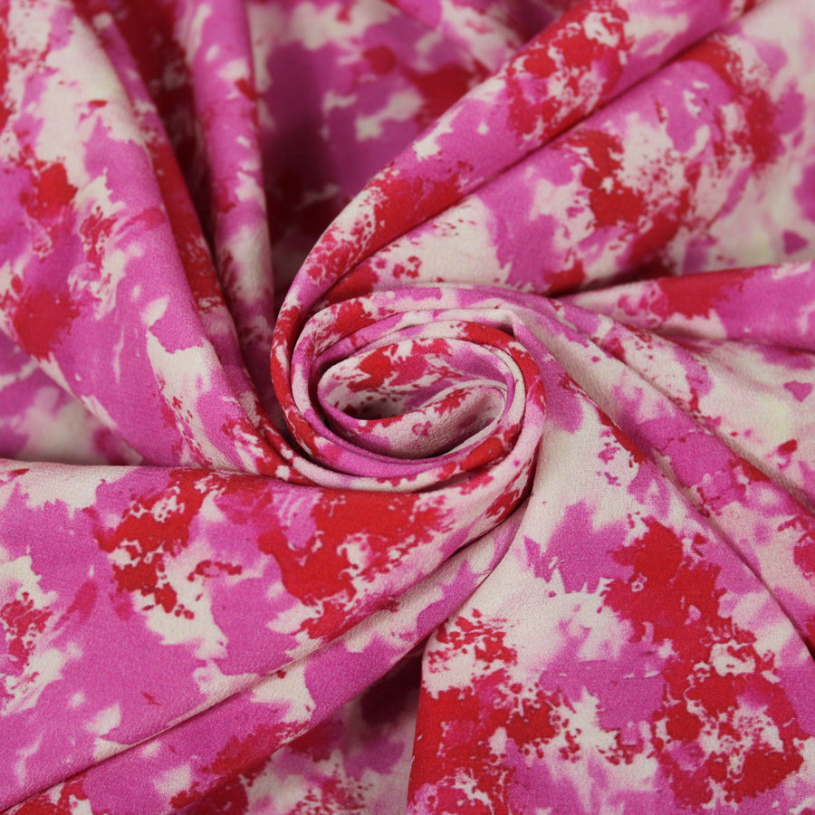 Tissu crêpe de chine 100% soie - imprimé tacheté - ton rose et rouge