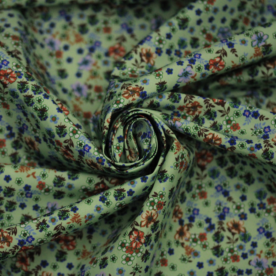 Tissu technique imperméable - imprimé fleuri - ton vert d'eau