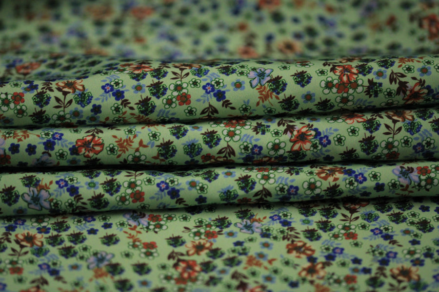 Tissu technique imperméable - imprimé fleuri - ton vert d'eau