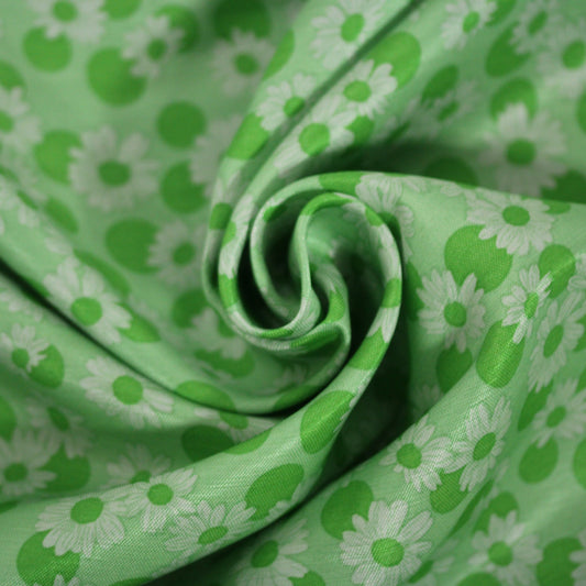 Tissu soie - imprimé marguerite - ton vert pomme - photo 1/4 | So Tissus