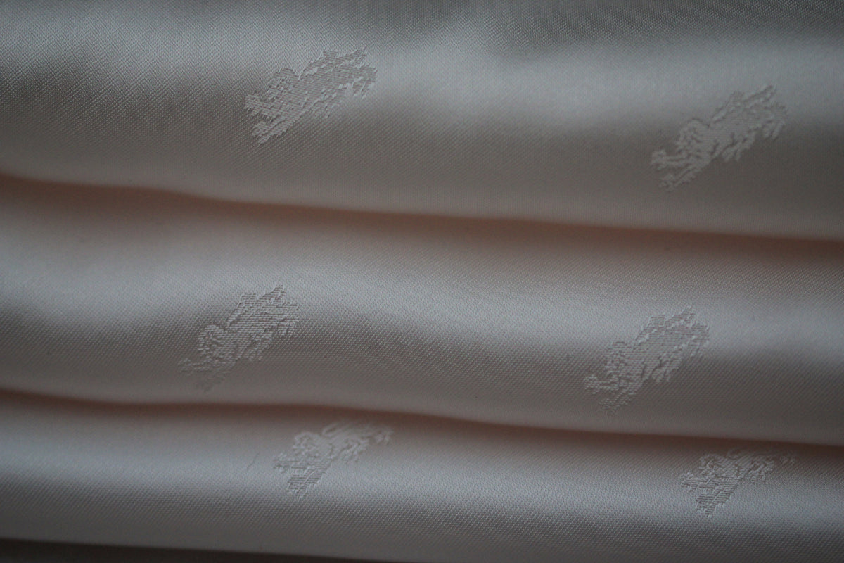 Tissu jacquard - motif lion - rose