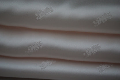 Tissu jacquard - motif lion - rose