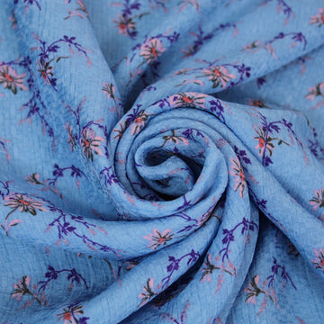 Tissu crêpe  gaufré - imprimé fleuri - ton bleu ciel