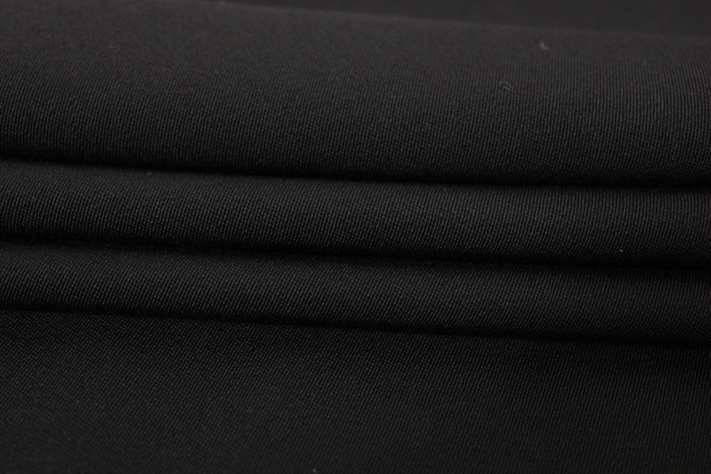 Tissu crêpe de laine stretch - noir - photo 2/3 | So Tissus