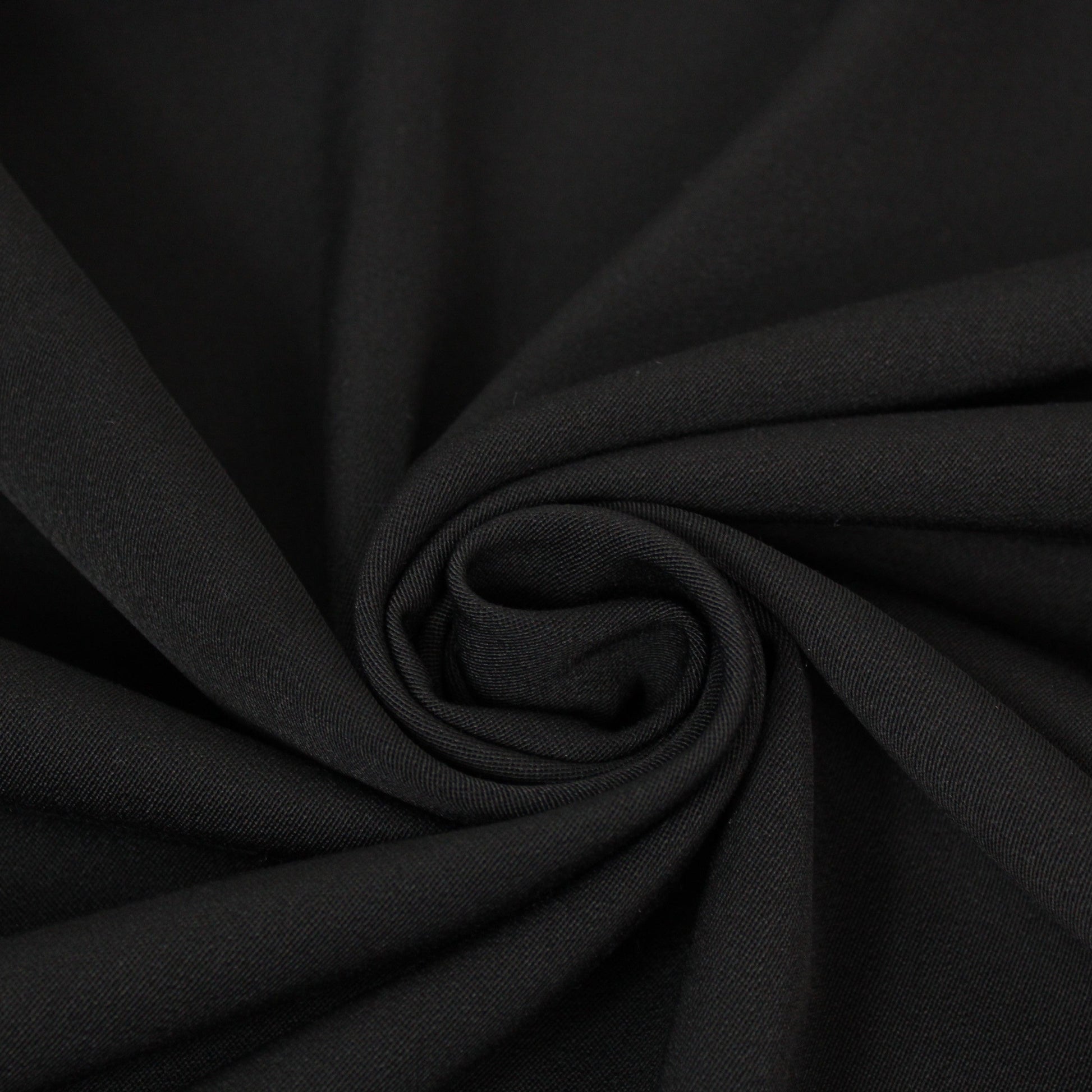 Tissu crêpe de laine stretch - noir - photo 1/3 | So Tissus