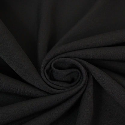 Tissu crêpe de laine stretch - noir - photo 1/3 | So Tissus