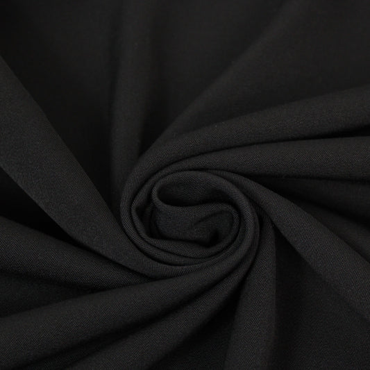 Tissu crêpe de laine stretch - noir - photo 1/3 | So Tissus
