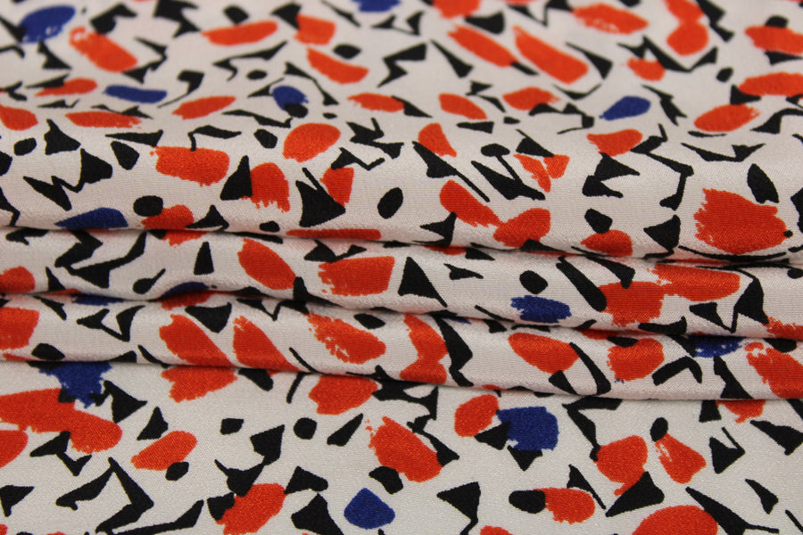 Tissu crêpe de chine 100% soie - imprimé tachetés - blanc, rouge, noir et bleu
