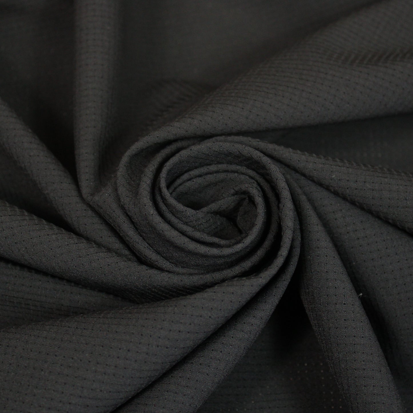 Tissu crêpe perforé - noir - photo 1/4 | So Tissus