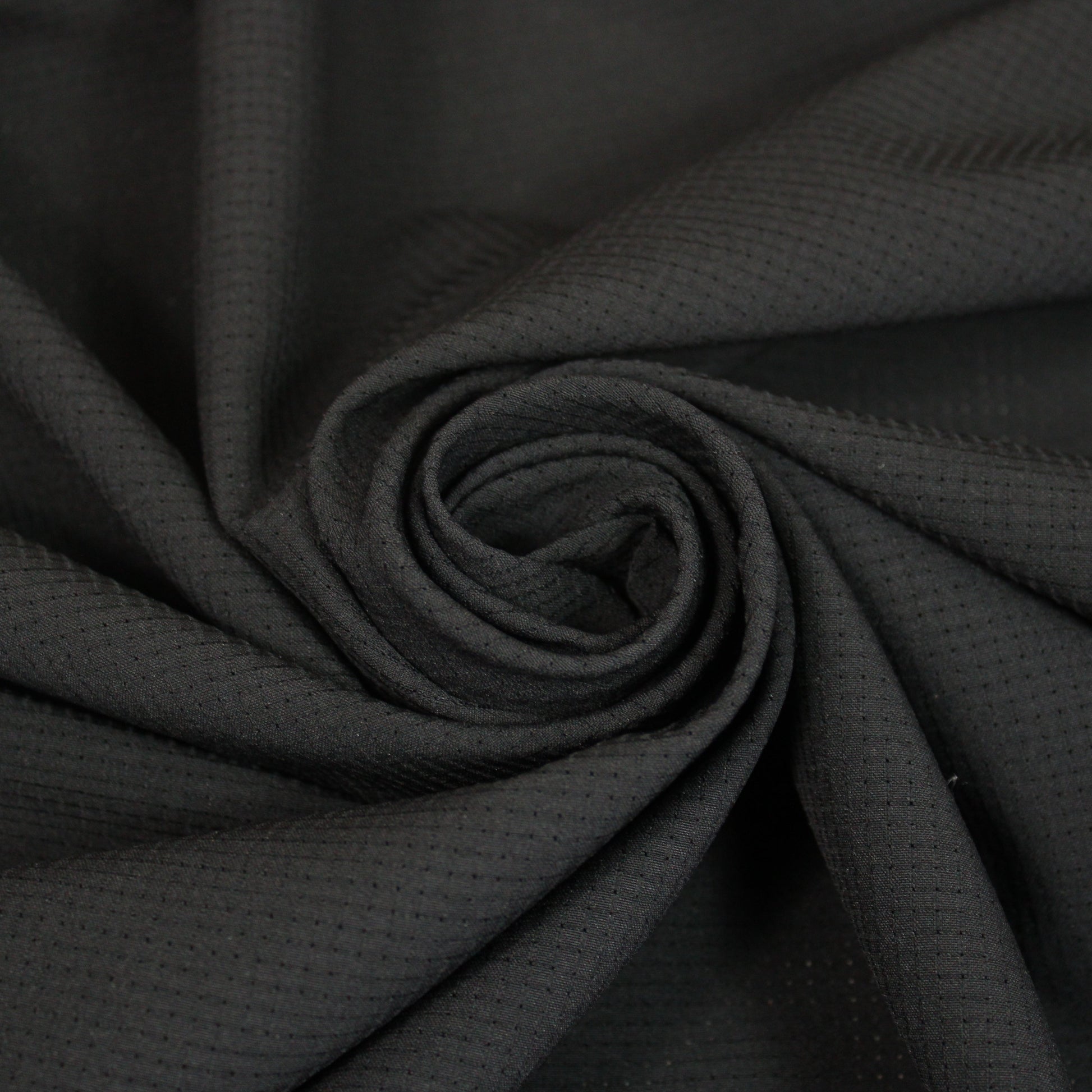 Tissu crêpe perforé - noir - photo 1/4 | So Tissus