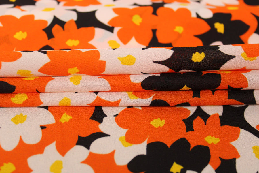 Tissu crêpe georgette  - imprimé fleurs vintages  - noir, orange et blanc