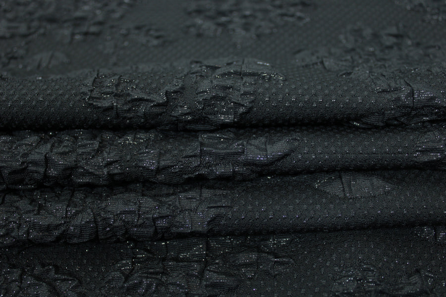 Tissu crêpe gaufré - motif fleuri - noir brillant