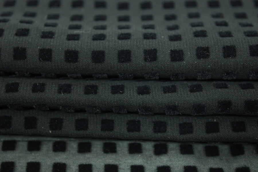 Tissu dévoré - motif géométrique - noir